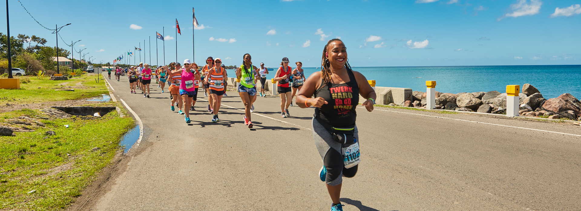 Runners on the coastal road at the Nevis Marathon & Running Festival